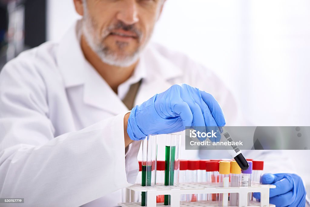 The research and development department Cropped shot of a male scientist conducting lab testshttp://195.154.178.81/DATA/istock_collage/1208633/shoots/784876.jpg Adult Stock Photo
