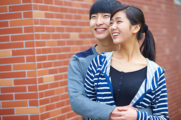 istock happy young asian couple holding together 530158611