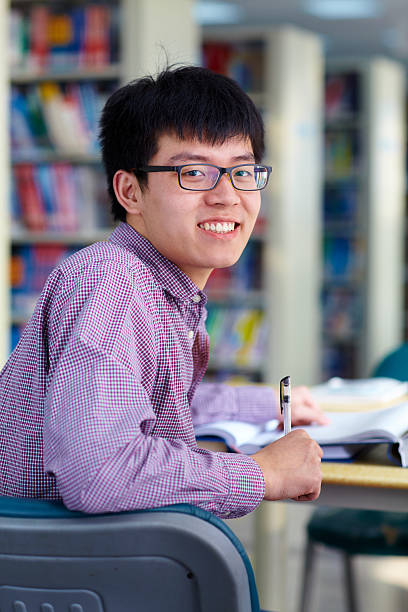 istock young asian college student in library 530158629