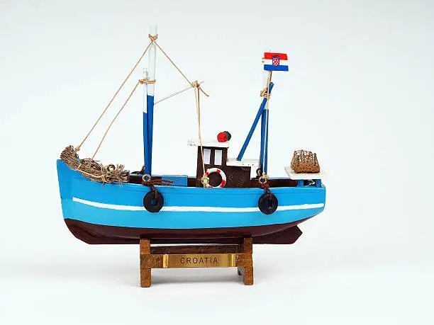 Model of wooden ship on a white background
