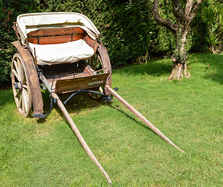 small carriage resting on the ground