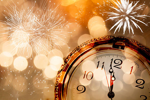 istock New Year greeting card with vintage clock and holiday lights 530163113