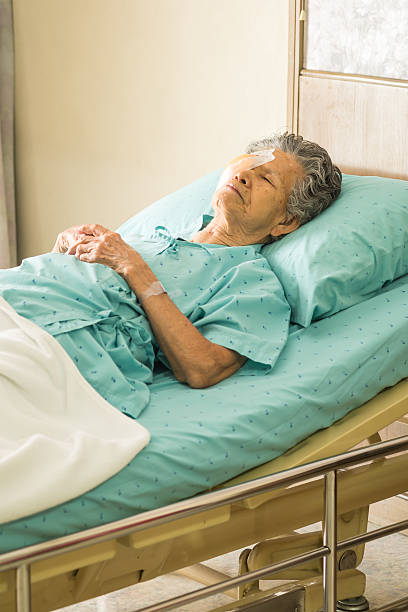 istock Elder female with eye patch sleeping after cataract surgery 530163899