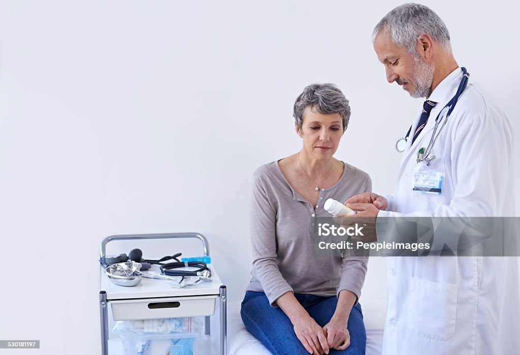 The benefits of good medication Shot of a mature doctor explaining medication to a patienthttp://195.154.178.81/DATA/shoots/ic_783910.jpg Adult Stock Photo