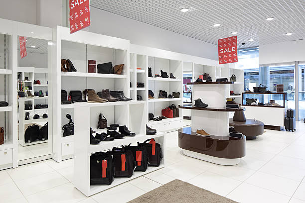 interior of shoe store in modern european mall bright and fashionable interior of shoe store in modern mall store display stock pictures, royalty-free photos & images