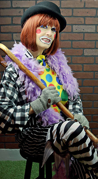 istock Female Clown Sitting With Legs Crossed 530182247