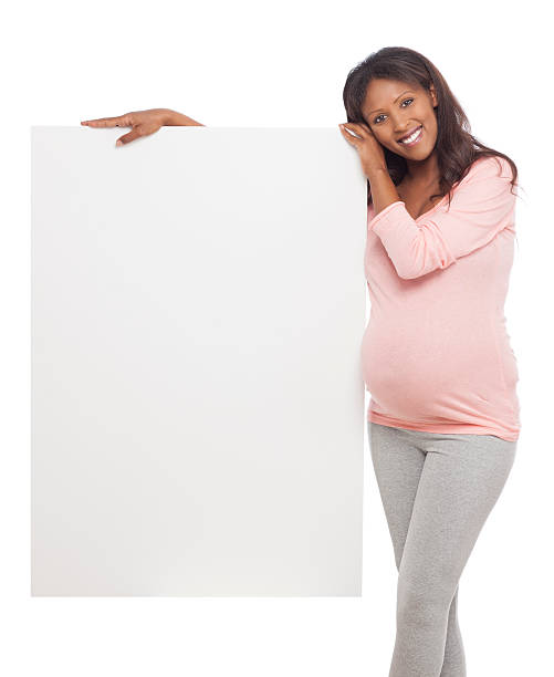 istock Pregnant woman showing a banner ad. 530182791