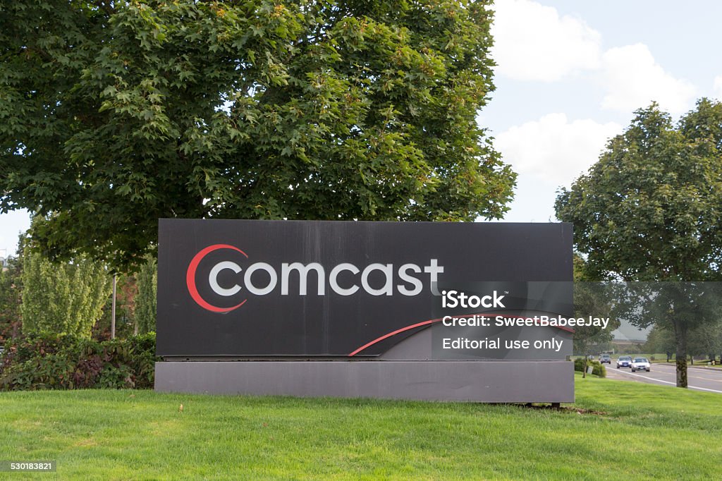 Comcast Eugene, OR, USA- September 26, 2014: Comcast Corporation is an American mass media company and is the largest broadcasting and cable company in the world by revenue. It is the largest cable company and home Internet service provider in the United States and the nation's third largest home telephone service provider. Comcast services U.S. residential and Comcast Stock Photo