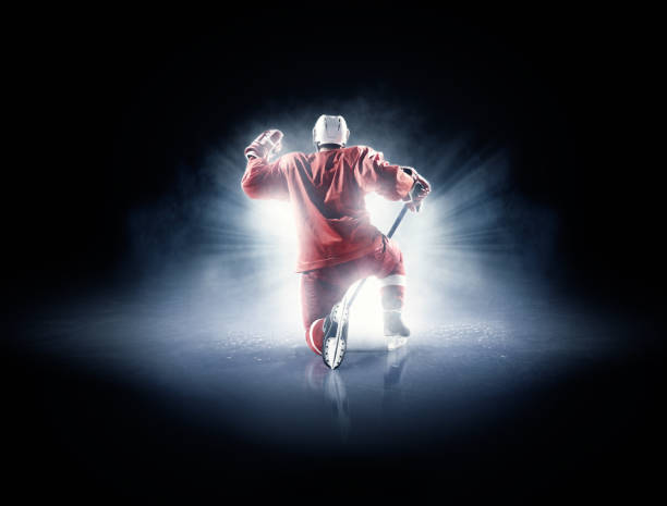 istock Ice hockey players in spotlight 530184637