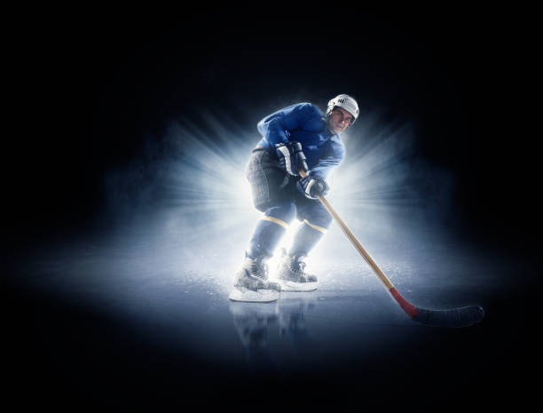 istock Ice hockey players in spotlight 530184643