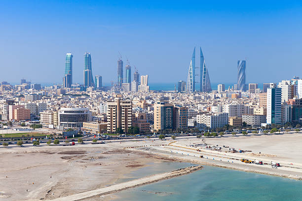 Bird view of Manama, Bahrain. Skyline with skyscrapers Bird view of Manama city, Bahrain. Skyline with modern skyscrapers standing on the coast of Persian Gulf bahrain stock pictures, royalty-free photos & images