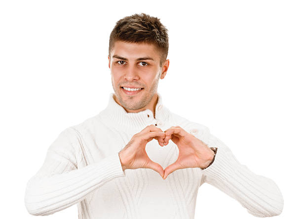 sign heart young man shows sign and symbol on white background cute boy show love symbol hand stock pictures, royalty-free photos & images