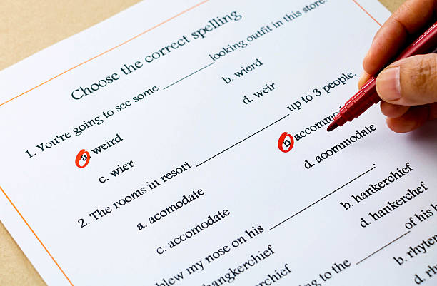 english grammar exercise on table red pen marked on multiple choices on english spelling vocabulary test misspelled stock pictures, royalty-free photos & images
