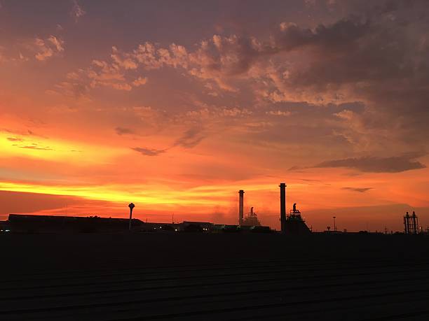 istock Industrial power plant in silhouette image at sun set. 530186060