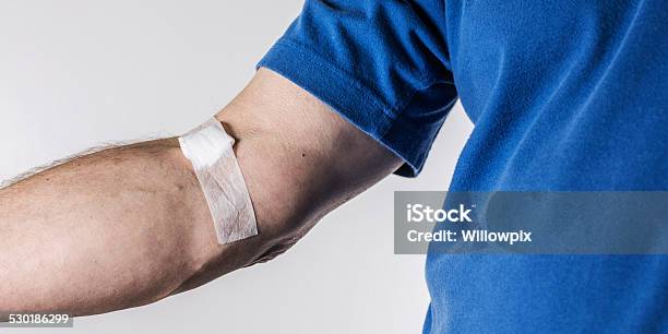 Bandage And Gauze On Senior Adult Arm Stock Photo - Download Image Now - Adhesive Bandage, Medical Test, Blood Donation