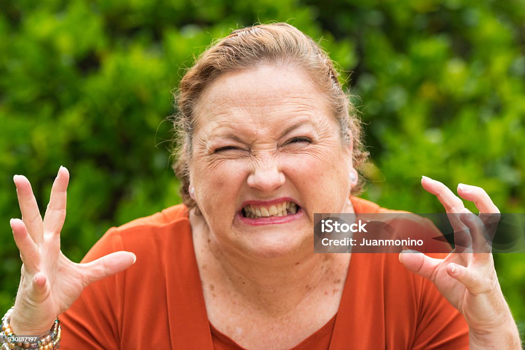Furious woman very furious woman looking at the camera 60-64 Years Stock Photo