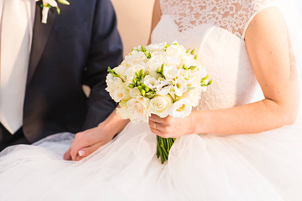 istock Bride holding big bridal bouquet on wedding ceremony 530188106