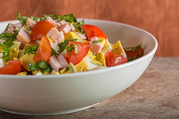 Salad with eggs and ham stock photo