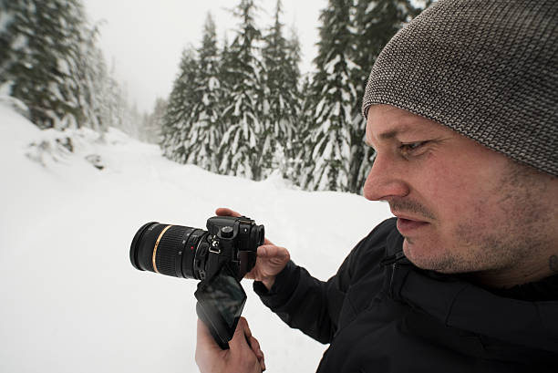 istock Photographer out in the Snow Getting the Shot 530189286