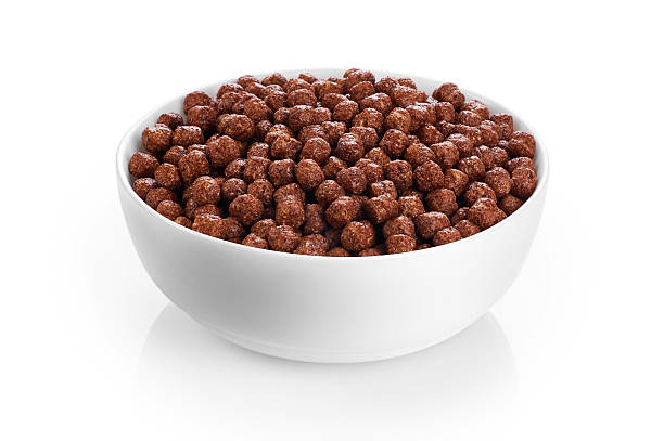istock Bowl with chocolate corn balls isolated on white background. 530193838