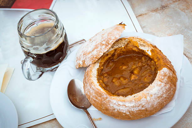 Goulash soup in bread in Strahov brewery (Klasterni pivovar Strahov) on the territory of the Strahov monastery (Strahovsky klaster) in Prague, Czech Republic