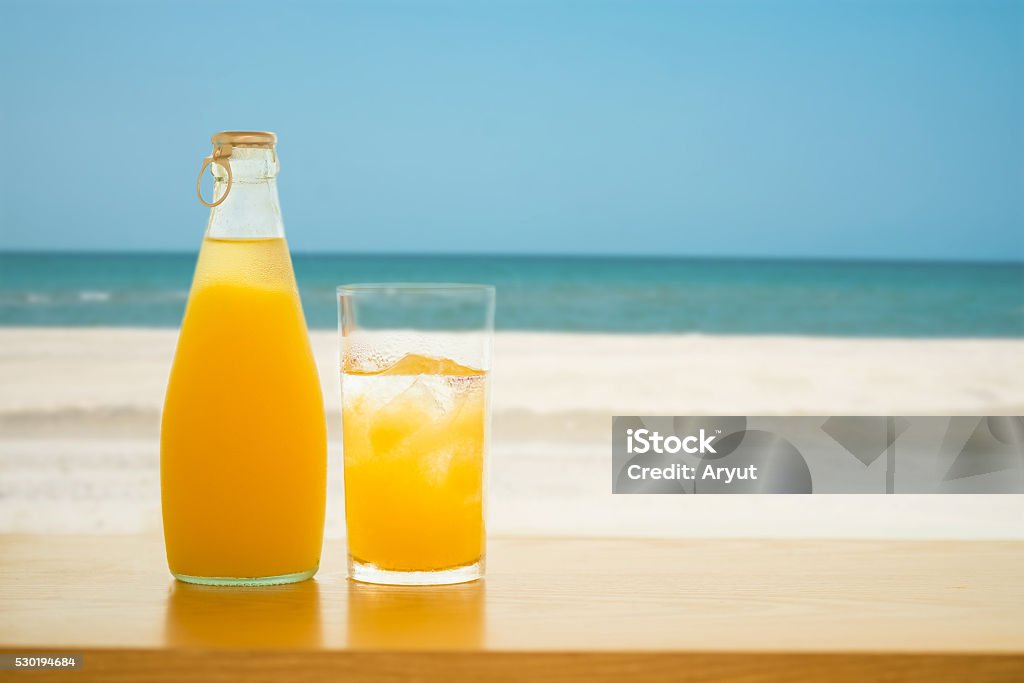 Pineapple juice Glass and bottle of Pineapple juice. Alcohol - Drink Stock Photo