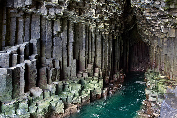 Fingals Cave - Staffa - Scotland Basalt rock formation inside Fingal's Cave on the island of Staffa in the Treshnish Islands in the Inner Hebrides off the west coast of Scotland. Fingal's Cave was made famous by the composer Felix Mendelsohn who visited the island in 1829 and then wrote the Hebrides Overture orpus 26, commonly known as the 'Fingal's Cave Overture. rock formation stock pictures, royalty-free photos & images