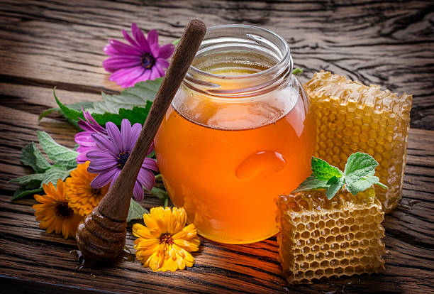 istock Jar full of fresh honey and honeycombs. 530199240