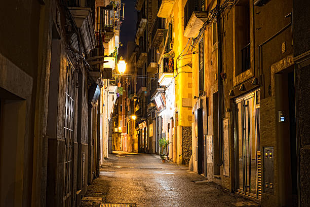 dark alley at night dark alley or seedy alley? Palma de Mallorca, Spain - alley at night in the old town seedy alley stock pictures, royalty-free photos & images