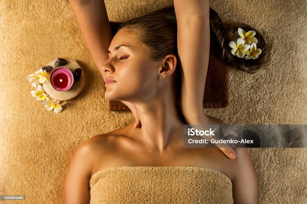 Relaxing massage. The beautiful girl has massage. Stretching massage moves. Adult Stock Photo