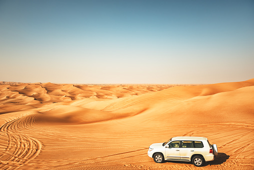 20 November 2020: Dubai, UAE: SUV cars on a Desert safari in the Dubai (dune bashing)