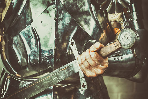 istock knight wearing armor and holding two-handed sword 530201140