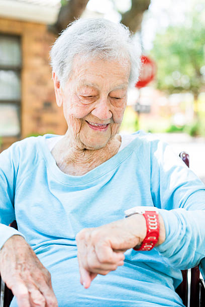 istock Senior Woman Looking at Her Smart Watch 530201184
