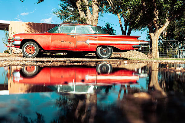istock Red Vintage American Car Reflected on a Puddle 530201343
