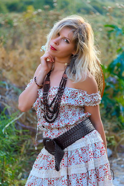 istock Blonde woman at summer meadow 530202441