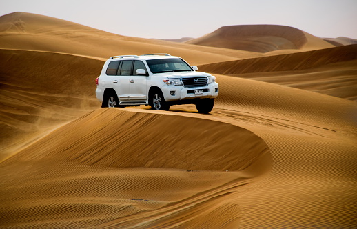 Dubai, United Arab Emirates - February 01: Desert safari with Dune bashing by a 4x4 car is a very popular activity.
