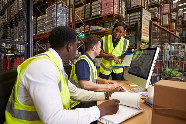 istock Team discussing warehouse logistics in an on-site office 530202674
