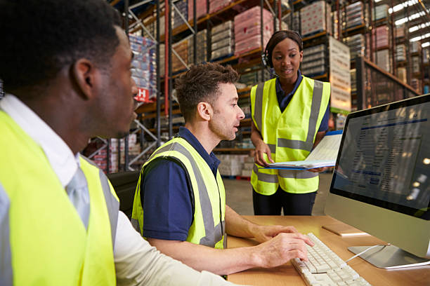 istock Team managing warehouse logistics in an on-site office 530202698