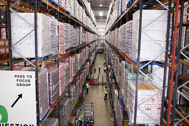 istock Elevated view of aisle between storage units in a warehouse 530202902