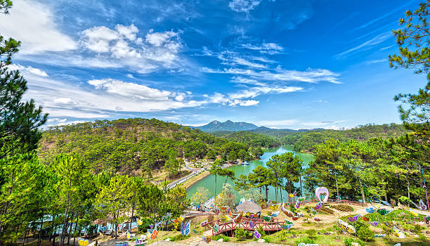 Dalat Love Valley on sunny day Dalat Love Valley on beautiful sunny day with a large pine forest in the valley lakes create romance for guests as lovers, this is also the landscapes of Lam Dong, Vietnam dalat stock pictures, royalty-free photos & images
