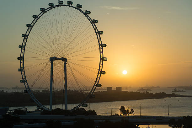 istock Singapore flyer at sunrise 530203698