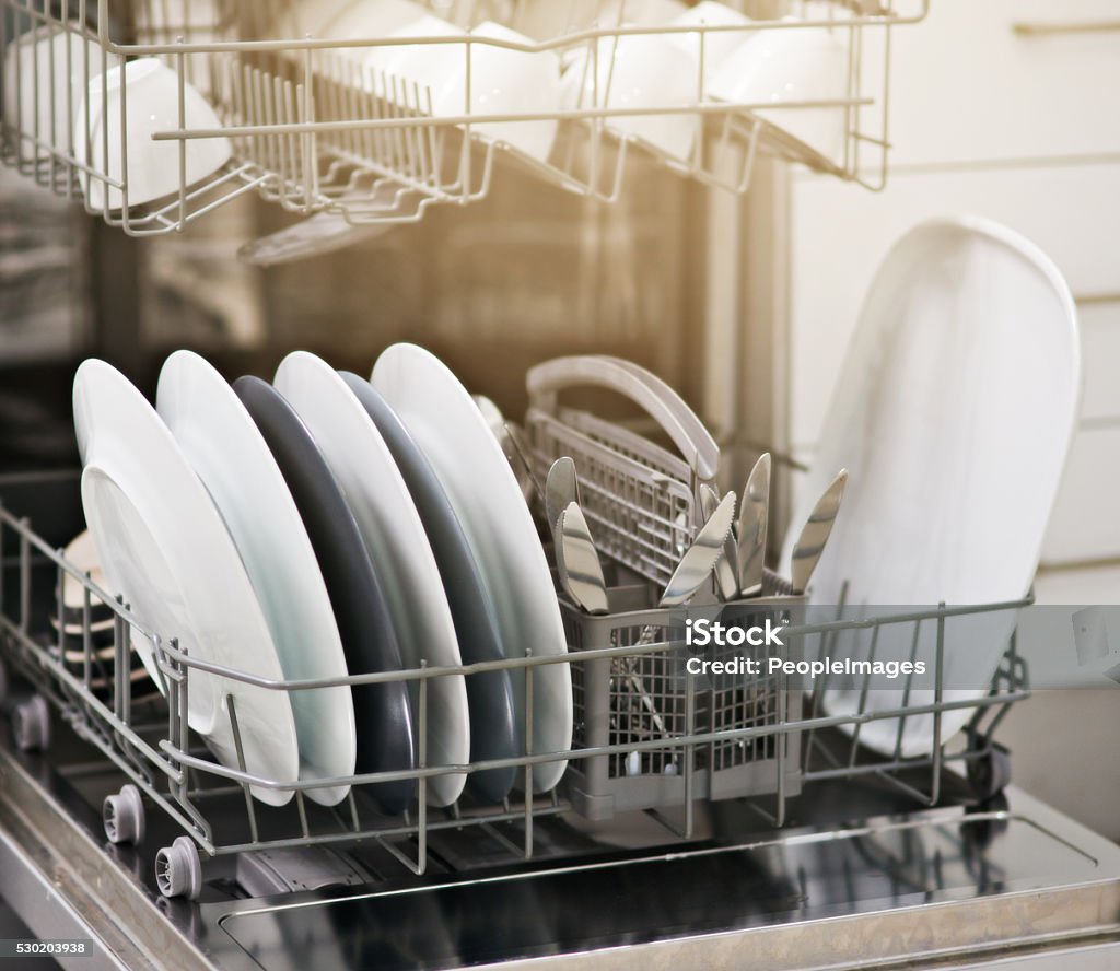 Dirty dishes no more Shot of a dishwasher at home Dishwasher Stock Photo