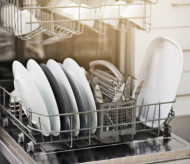 Dirty dishes no more Shot of a dishwasher at home dishwasher stock pictures, royalty-free photos & images