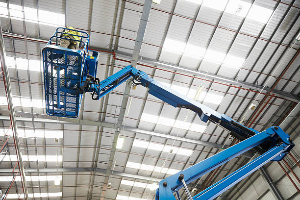 istock Low angle view of a cherry picker being used in a 530204576