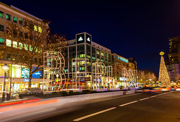 Berlin, Germany - December 3, 2013: Illuminated BERLIN signage in the middle of Tauentzienstrasse, a major shopping district in Berlin, Germany during Christmas. Traffic can be seen passing through and several buildings and shops can be seen in the background.