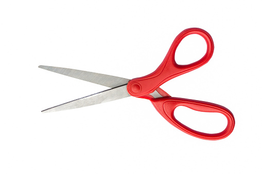 extrmely close up of scissors on red background