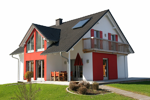 Bad Vilbel, Germany - March 11, 2007: A modern, low energy consuming detached house from manufacturer DIG House had been built on top of a small green and is now waiting for potential buyers. Like all houses from this manufacturer is is ready built and fully equipped from basement to roof including modern heating concepts, solar panels and even partially furniture.