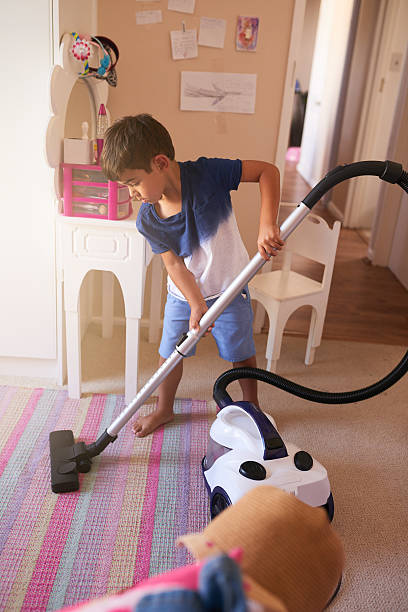 Red pellet stove ash vacuum cleaner on white background