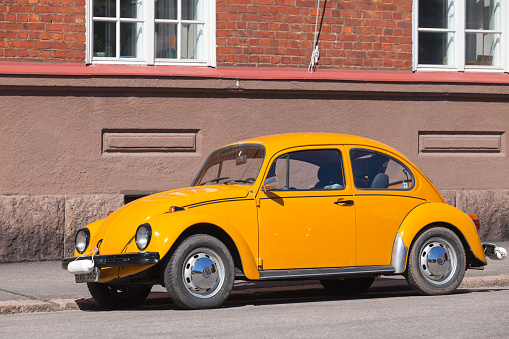 Helsinki, Finland - May 7, 2016: Old yellow Volkswagen beetle, front view