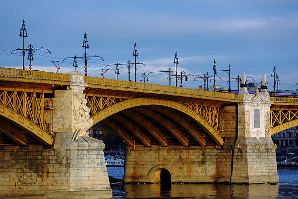 istock Old bridge over the river at dusk 530205973